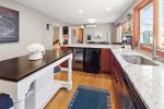 Beautifully renovated kitchen is well-equipped with ample counter space